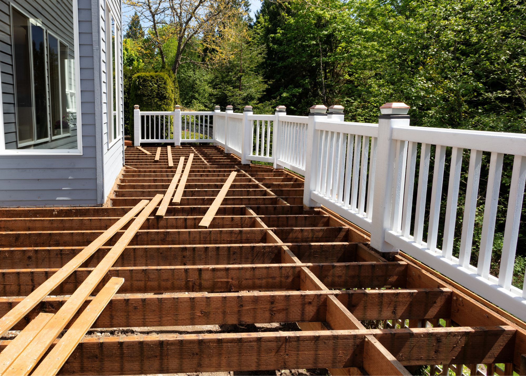 Coastal home deck being rebuilt with new framing and railings
